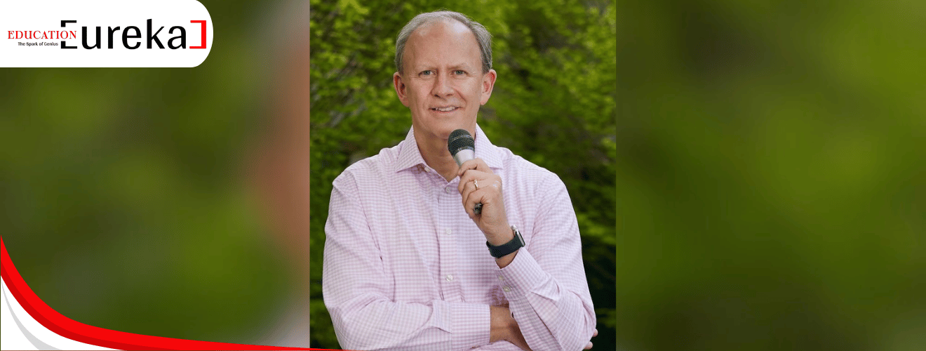 Bill Carmody holding a microphone, featured as a keynote speaker in Education Eureka 2025.